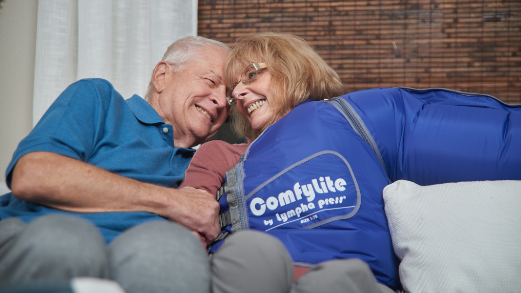 Senior couple with woman wearing lymphedema compression garment