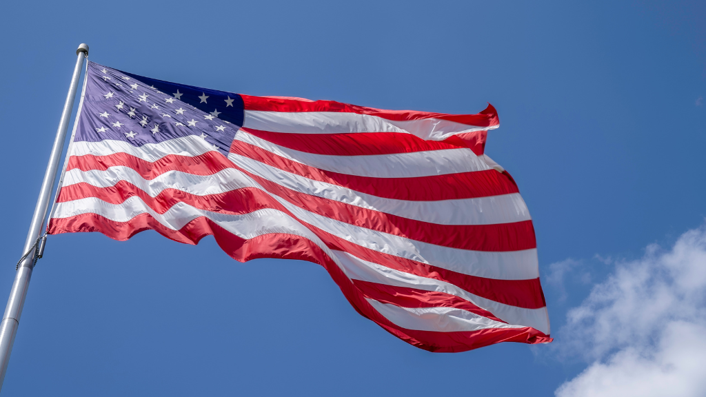 An American flag billows in the wind.